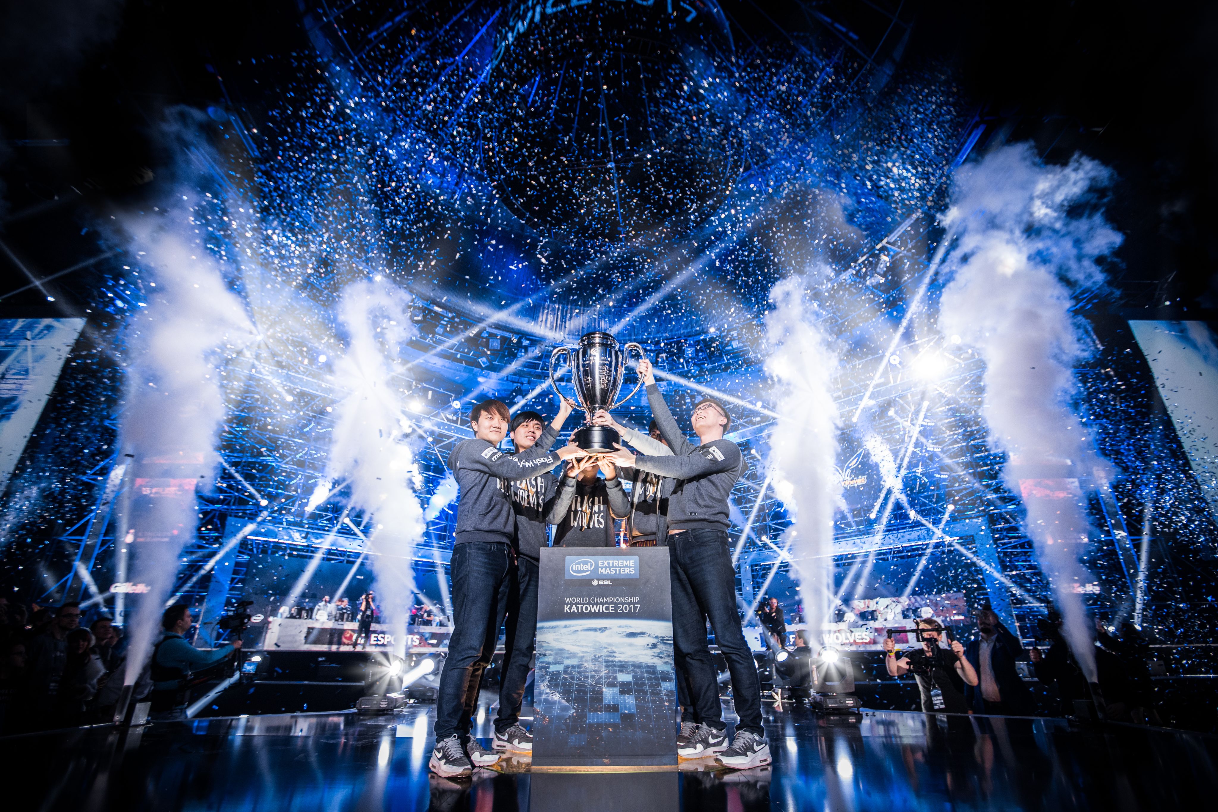 Photo showing Taiwanese esports team Flash Wolves lift the trophy after winning the IEM World Championship for League of Legends in 2017.